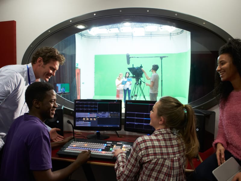 People in an audio and video recording booth