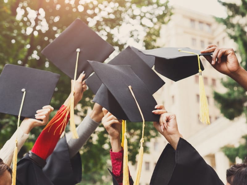 Graduates tossing their caps in the air