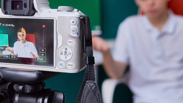 A video camera recording a student